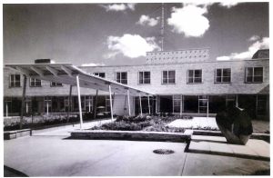 grand front entrace of institution with landscaping