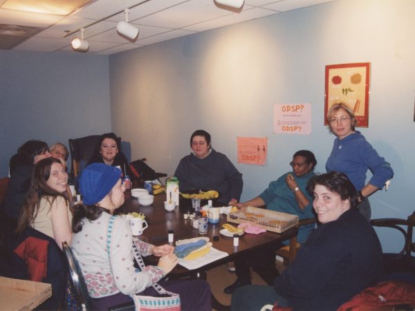 Group of PARC members doing art activity around large table