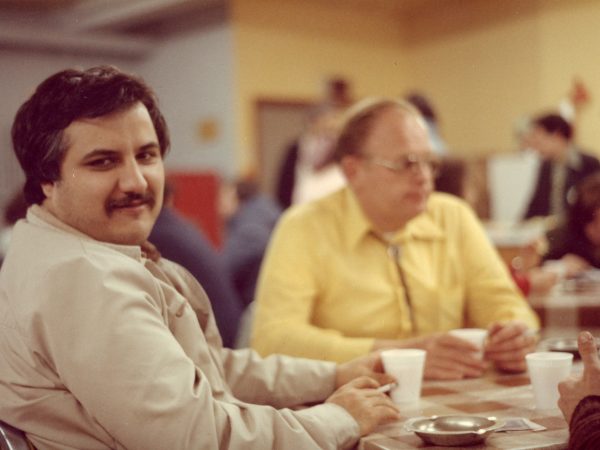 Two men having coffee at table in PARC Drop-In