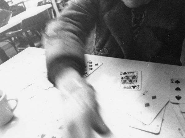 Older woman playing cards at PARC Drop-In