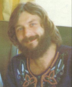 Reville with beard, long hair and embroidered "peasant" shirt