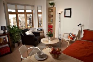 Interior view of apartment in Edmond Place showing bed and living area. This looks like a nice place to live.