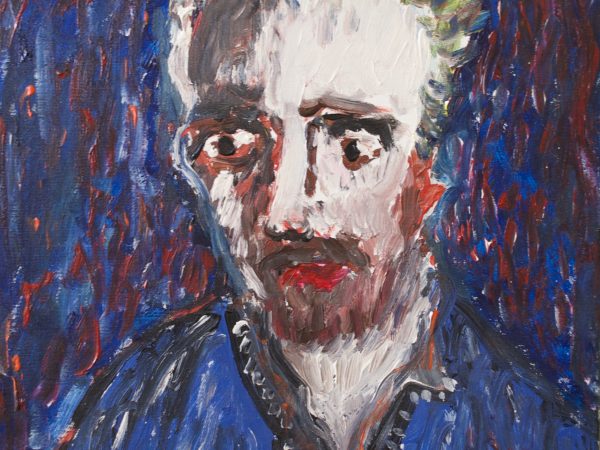 portait of man in blue shirt