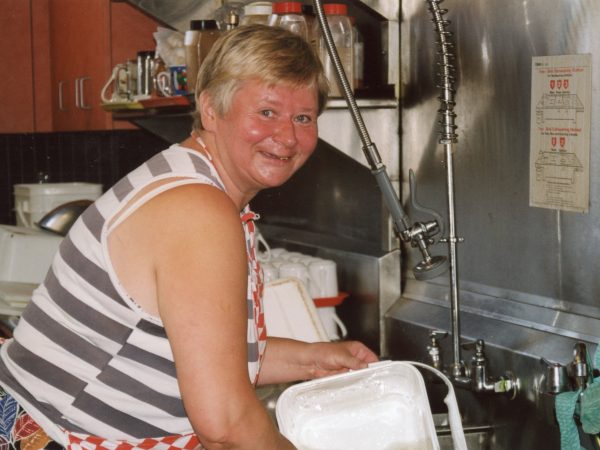 photo of woman at the sink at PARC doing dishes