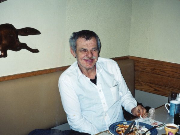 Photo of man at table at PARC eating meal