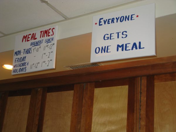 Photo of food signs at PARC - "Meal Times" and "Everyone Gets One Meal"