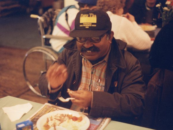 Photo of man at table at PARC eating meal