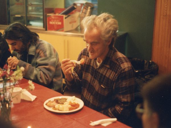 Photo of mealtime at PARC with comical figure of woman in the front