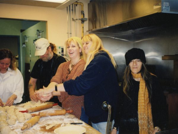 Kitchen photo at PARC with group of people making rolls