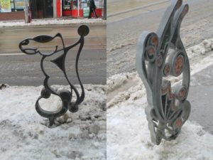 Winter photos of whimsical iron bike stand outside the front of PARC