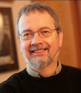 middle aged man with beard and glasses